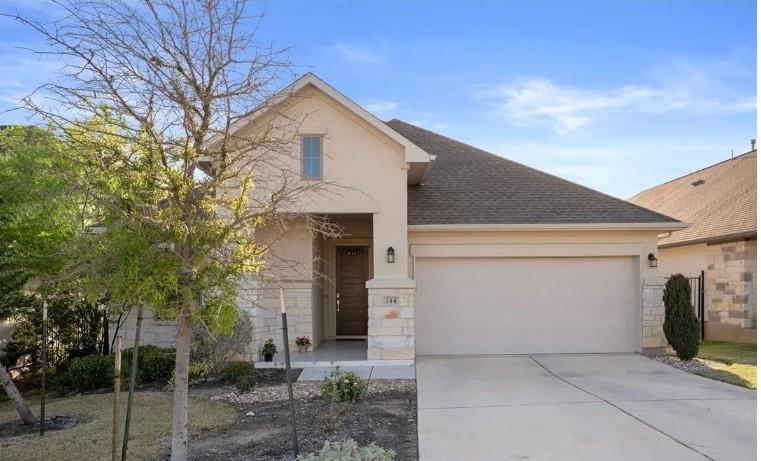 Limestone and stucco exterior details accent this