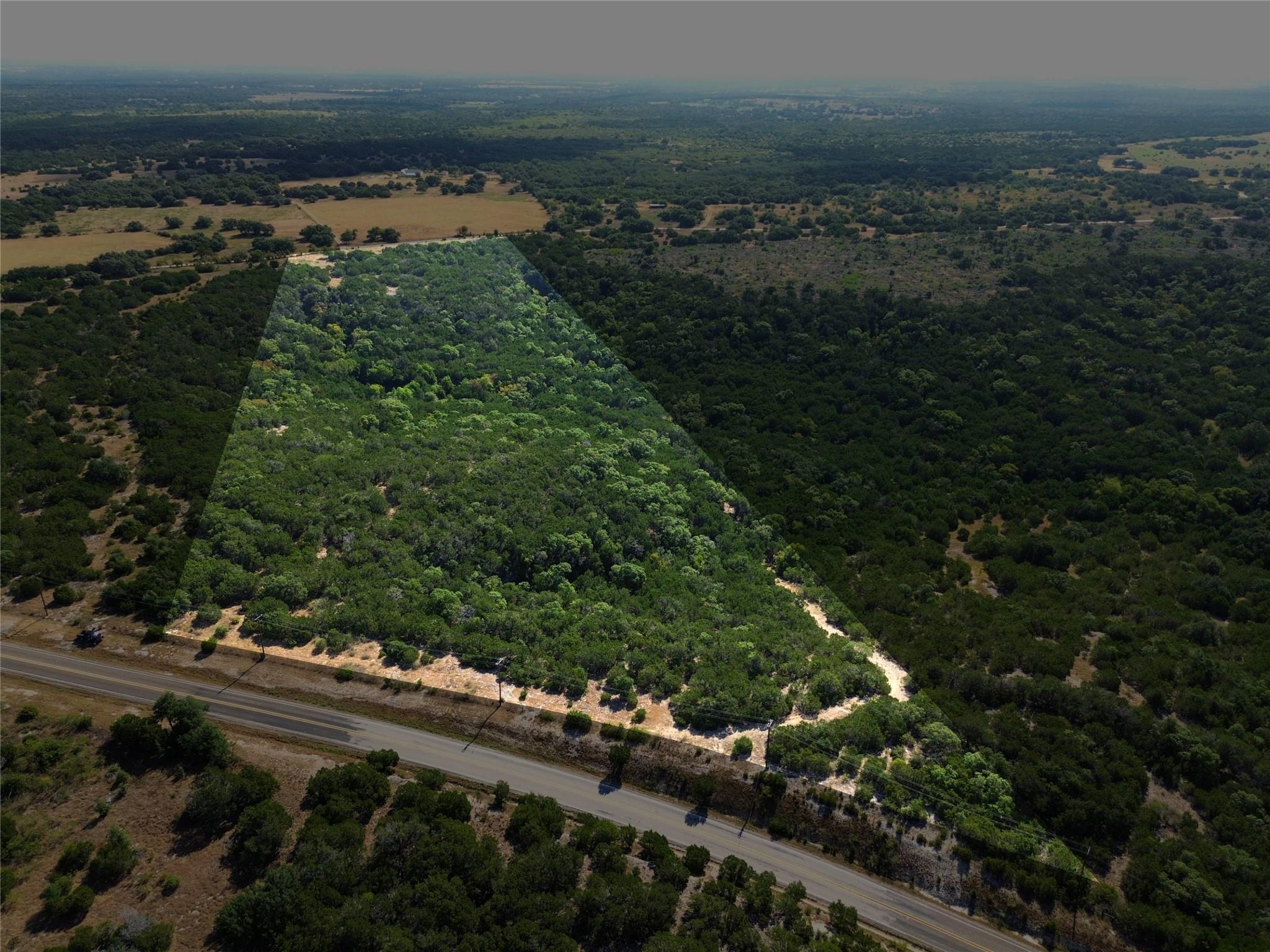 Densely wooded acreage offers an expansive natura