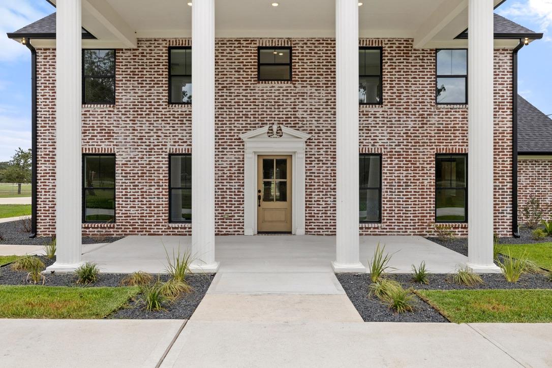 Stately white columns and classic brickwork frame