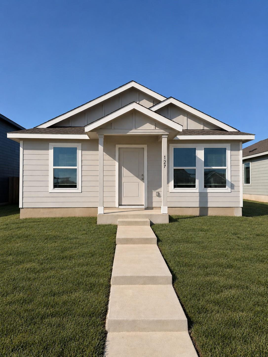Crisp architectural lines and a welcoming entry p