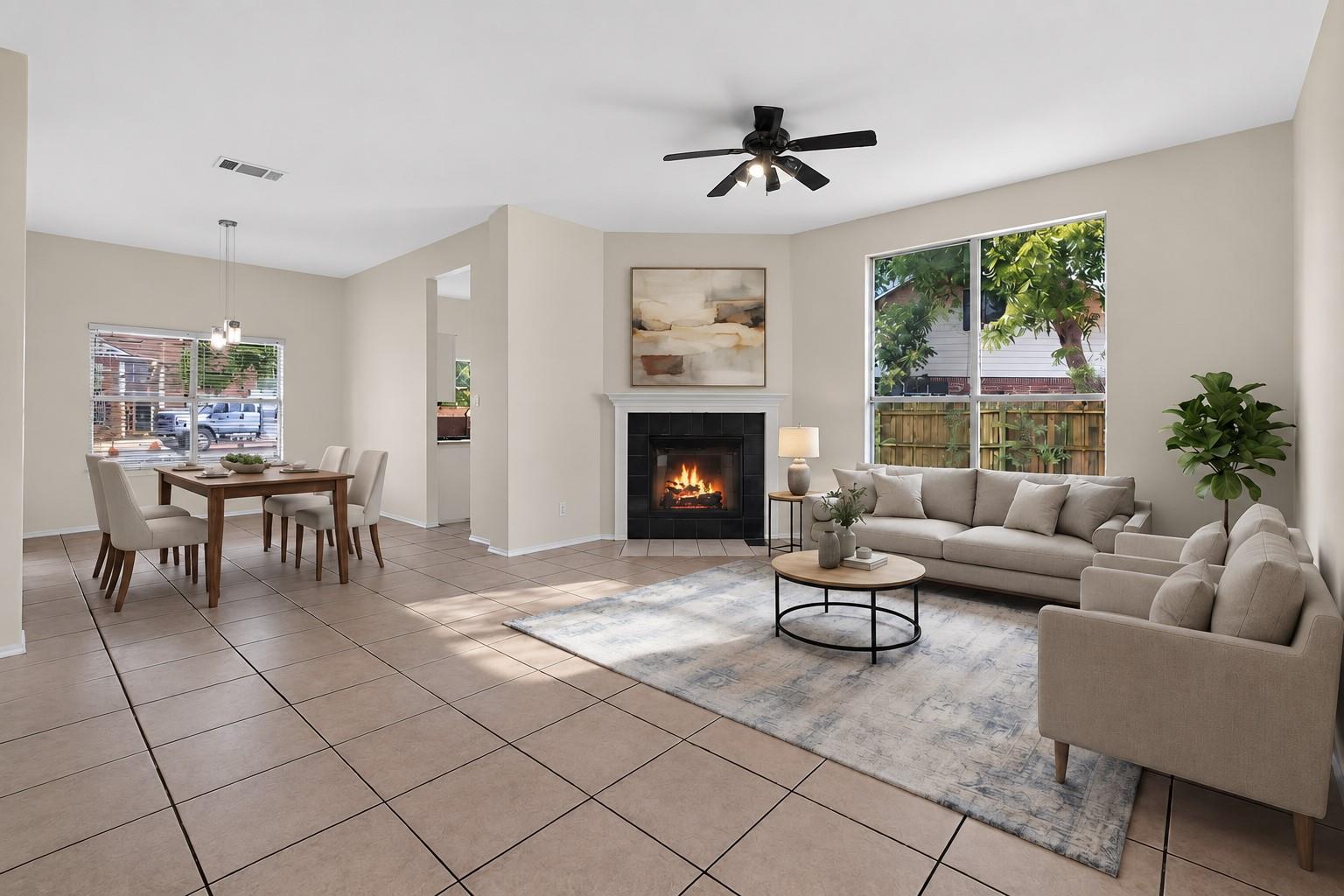 An open layout connects the tile-floored living r