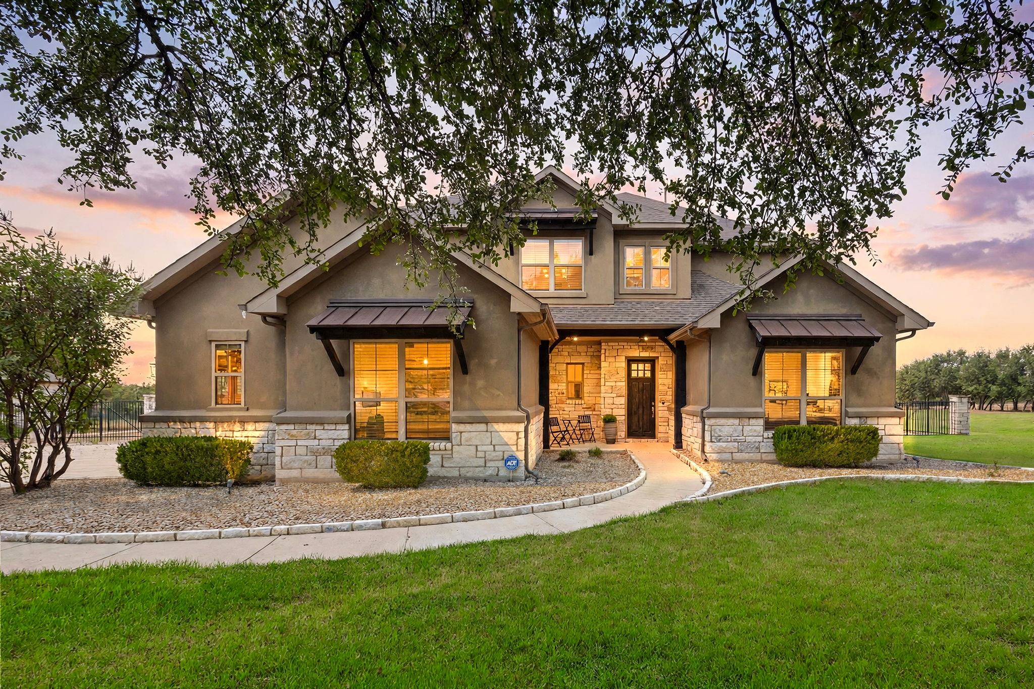 Stone and stucco accents define this elegant mult