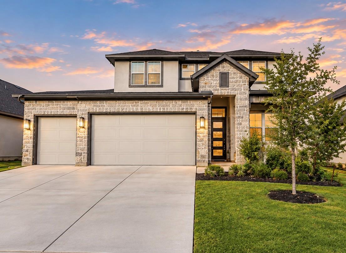 Stone and stucco exterior finishes create impress