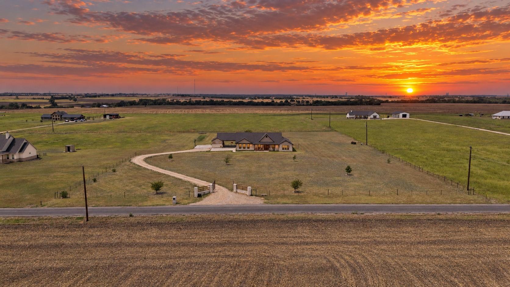 Expansive country acreage centers on a modern ran