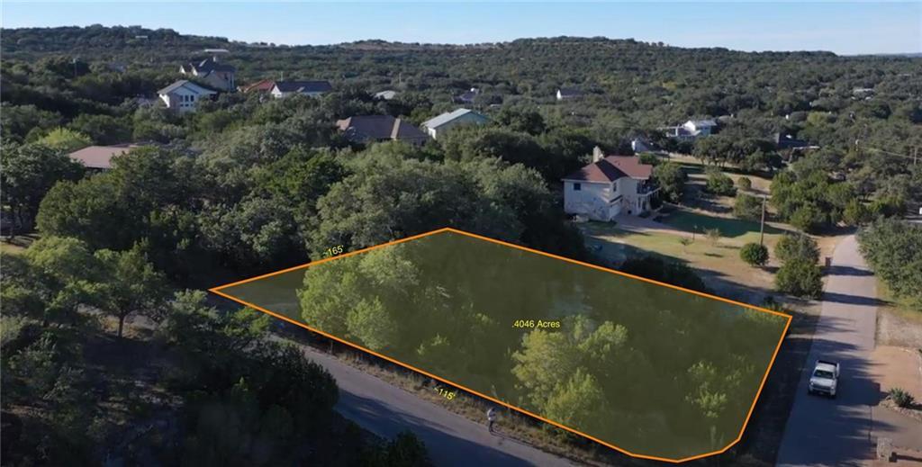 Mature trees blanket this scenic residential lot 