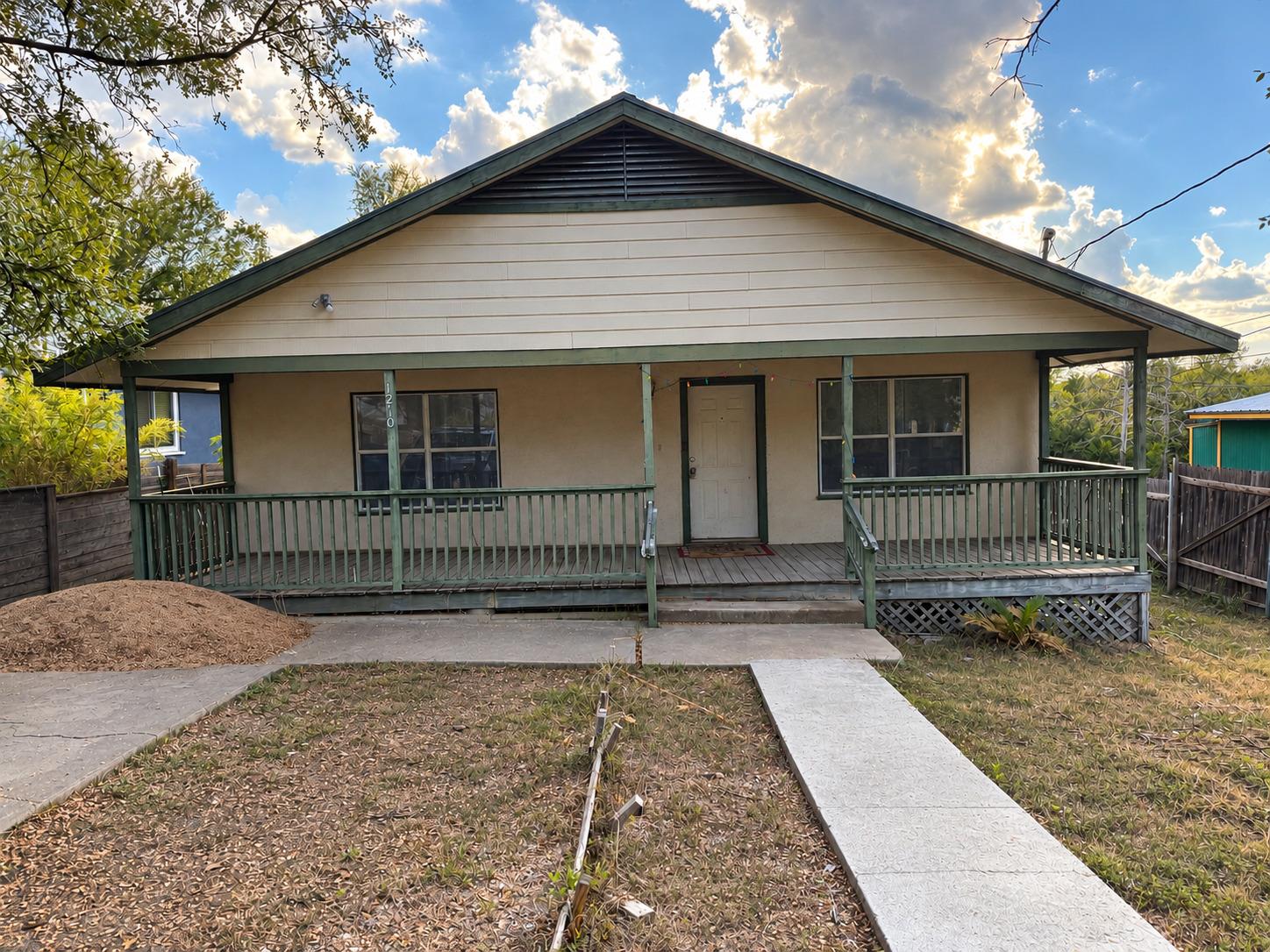 A spacious covered front porch spans the length o