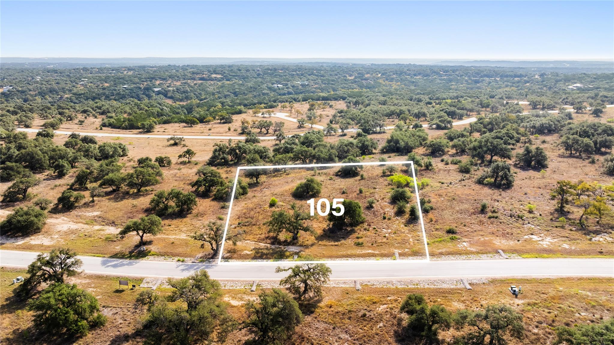 An aerial perspective showcases a rolling country