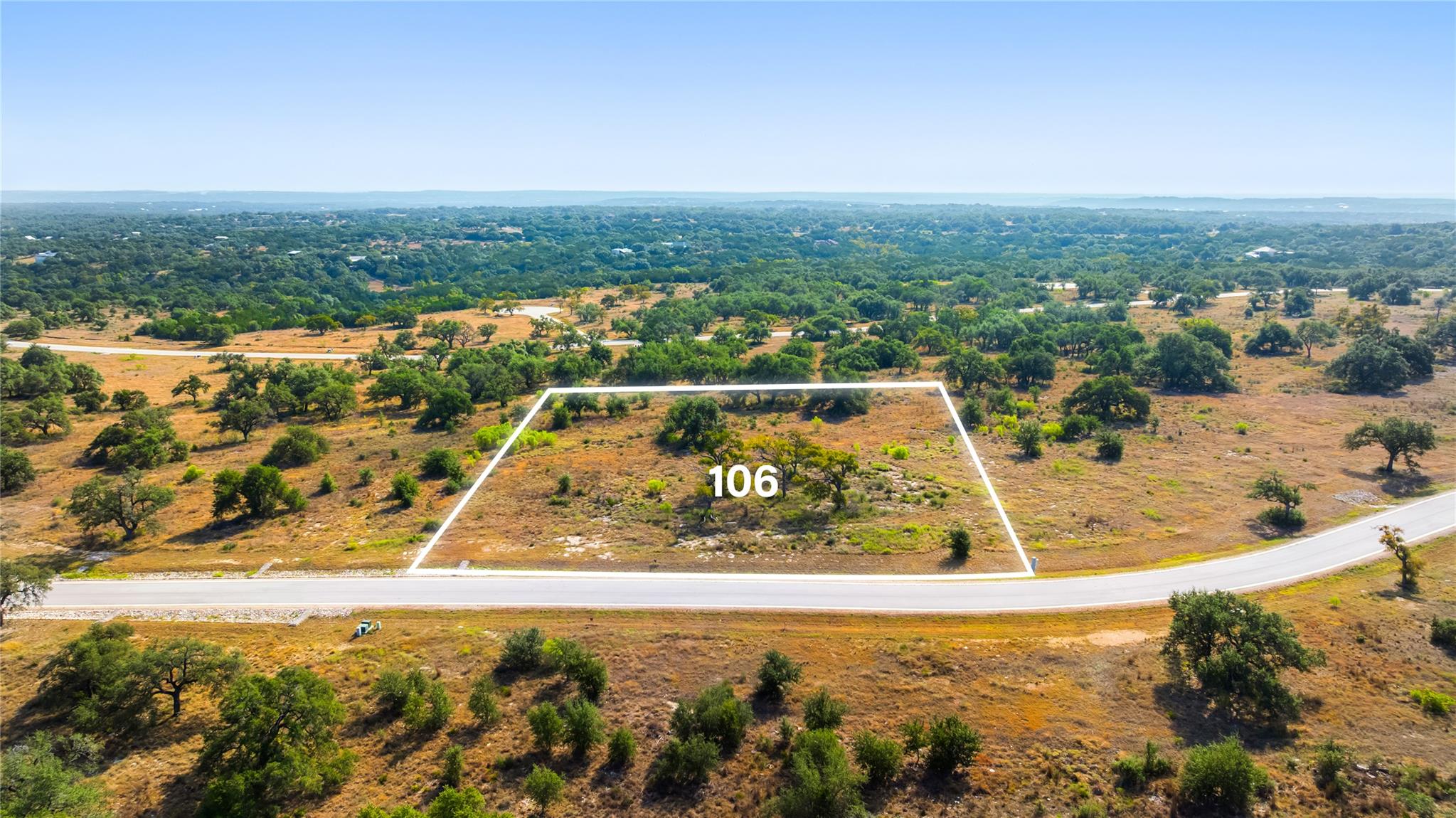 A spacious building lot showcases sweeping countr