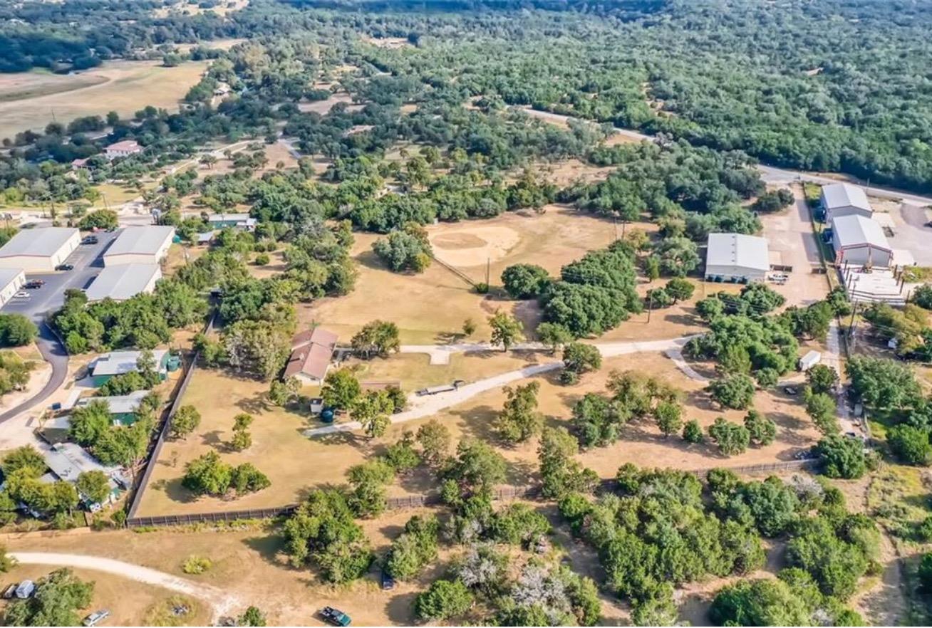 Mature trees and open green spaces frame this spr