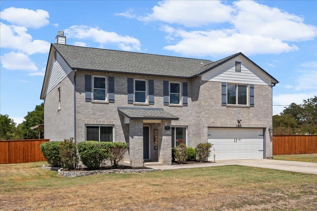 A classic two-story brick exterior greets visitor