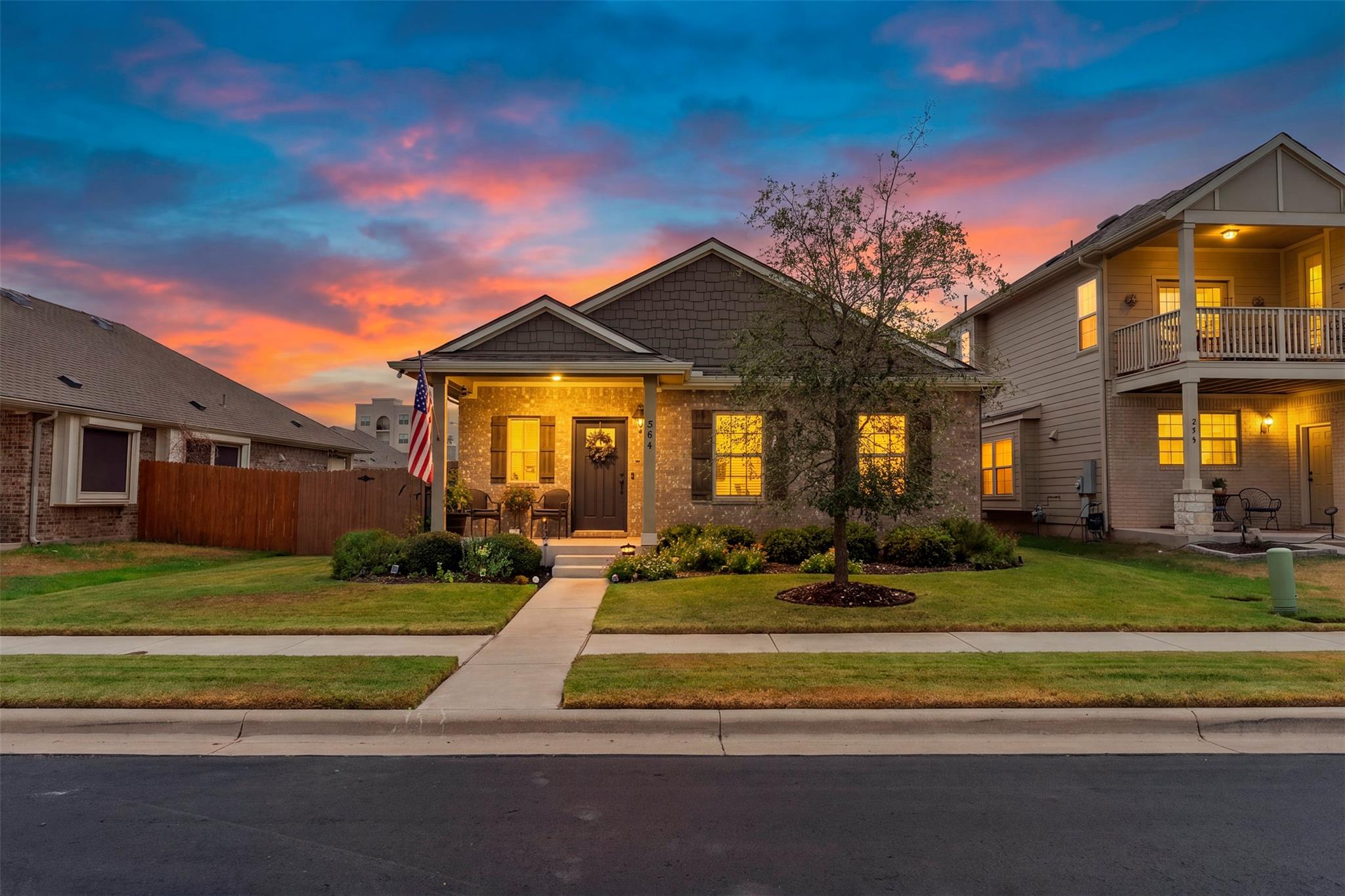 Warmly lit brick-accented exterior displays class