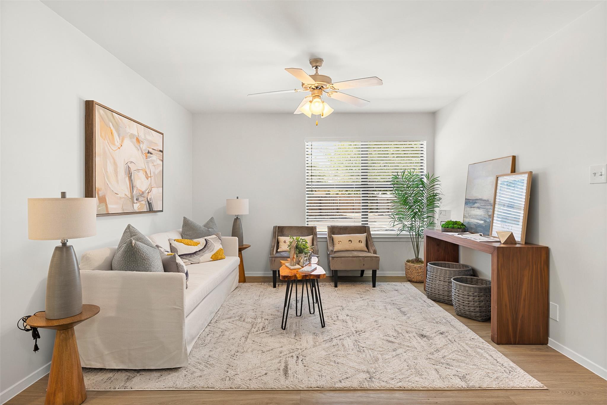 A wide window illuminates this living area finish