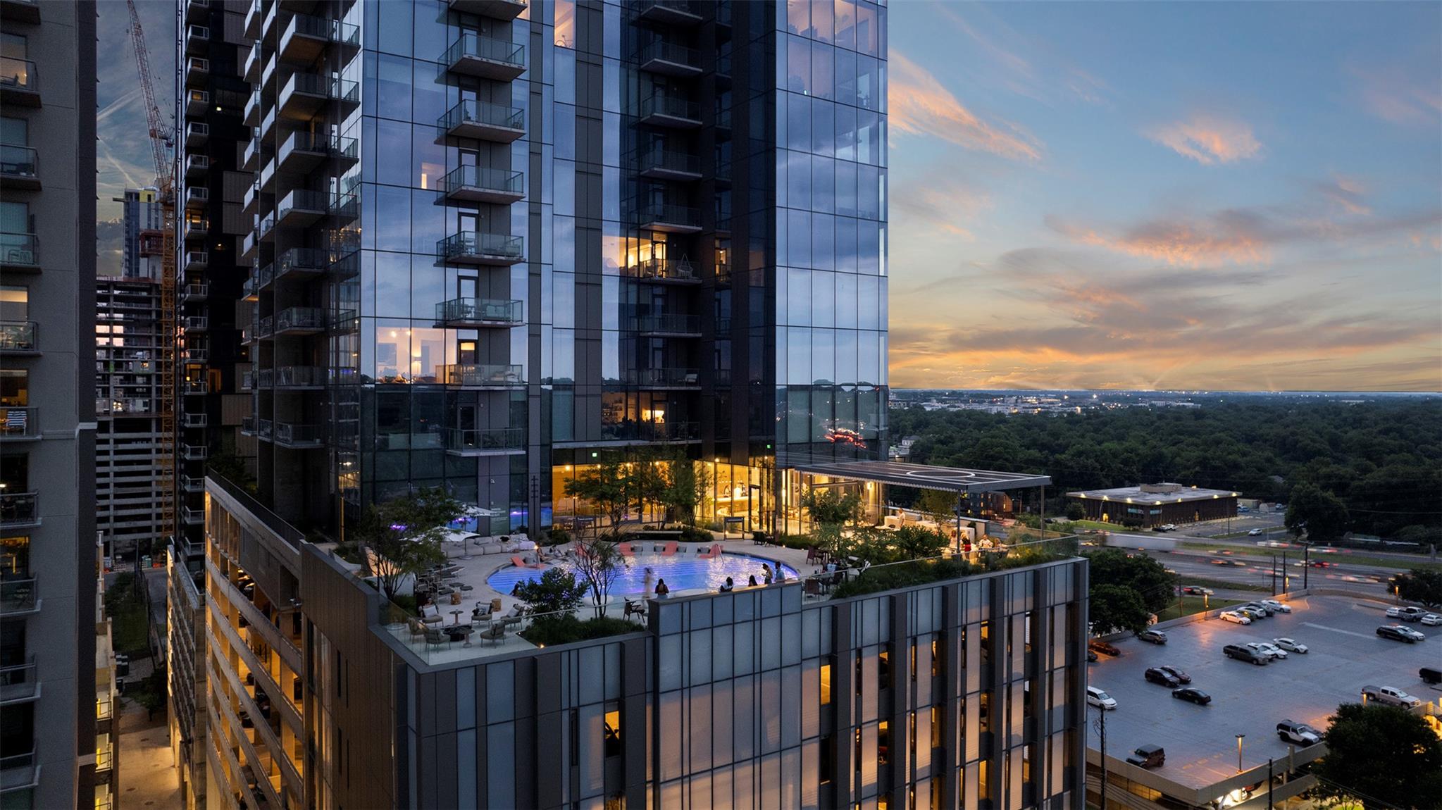 Dramatic glass elevations soar above an elevated 
