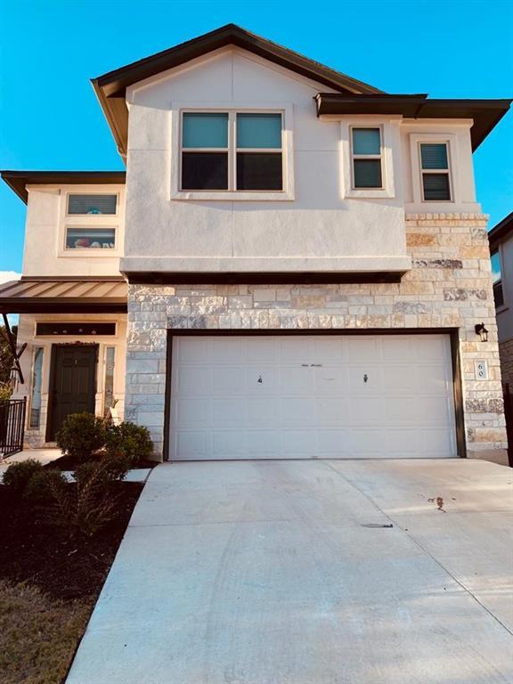 An inviting stone and stucco exterior presents a 