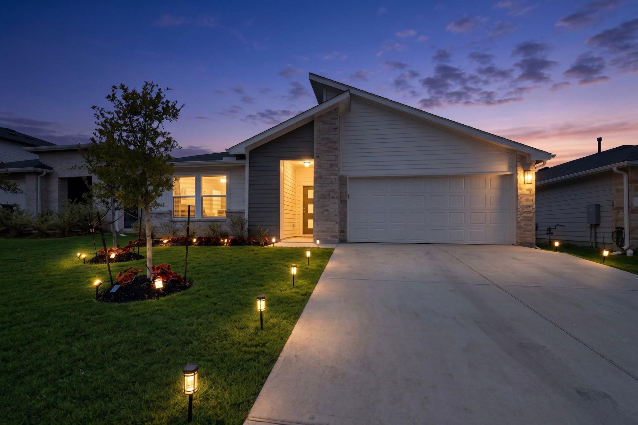 Dramatic rooflines and stone accents define this 