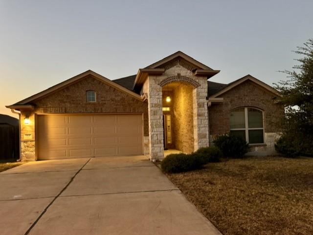 Brick and stone exterior detailing accents the we