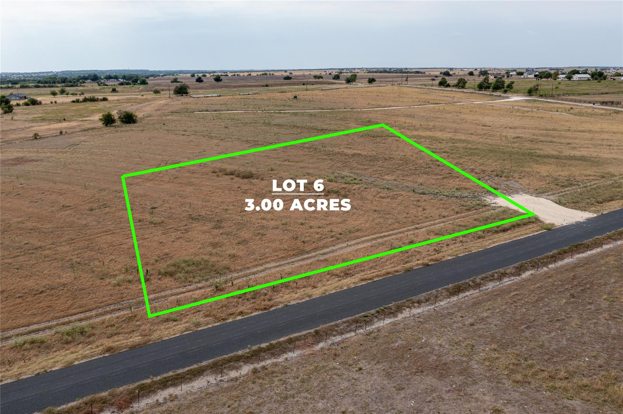 An aerial perspective showcases a level acreage p
