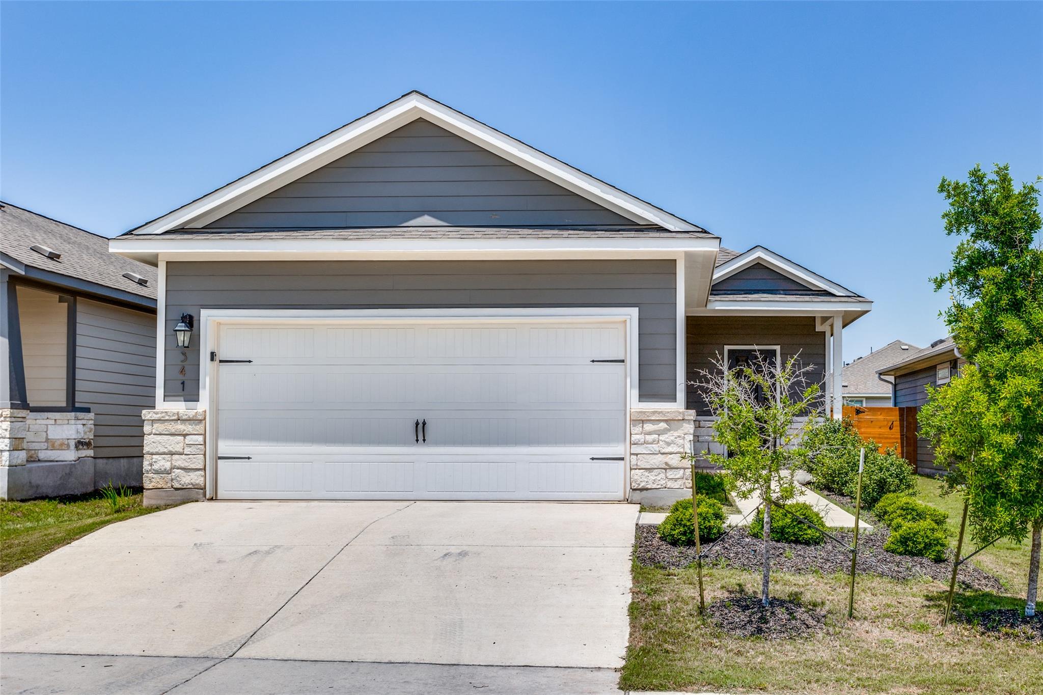 Clean lines and a spacious driveway define this m