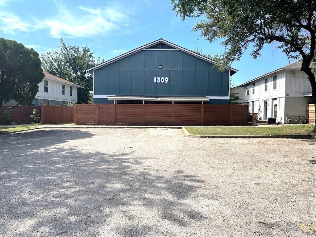 A classic board and batten facade stands behind a