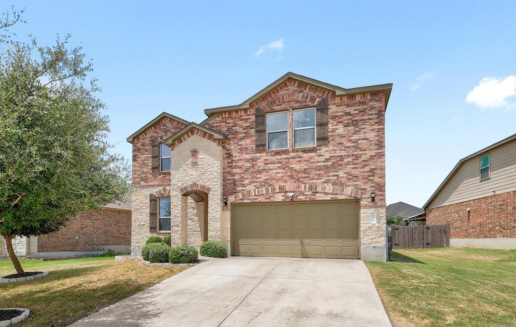 Multi-textured brick and stone detailing defines 