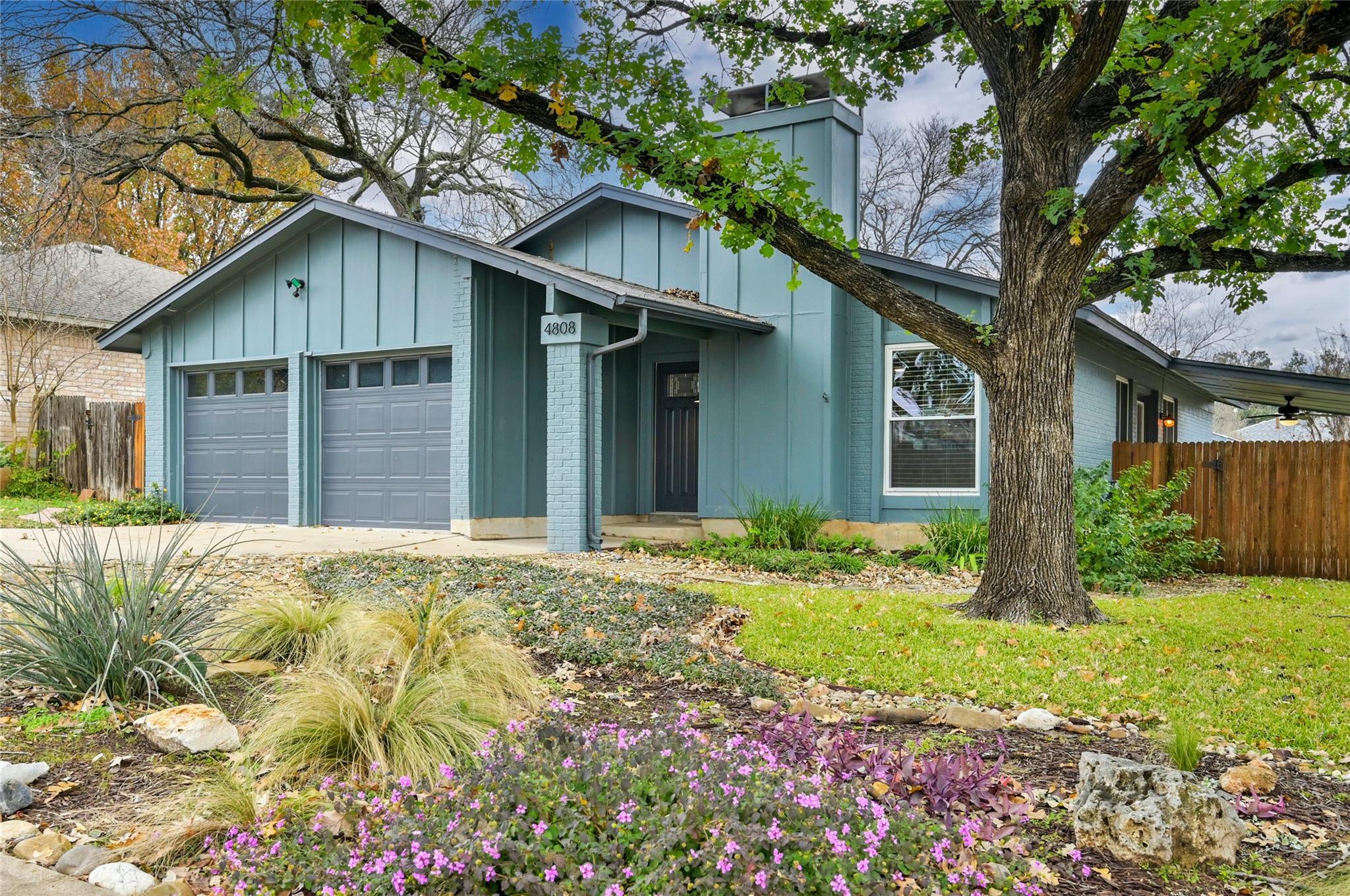 Board and batten siding pairs with brick accents 