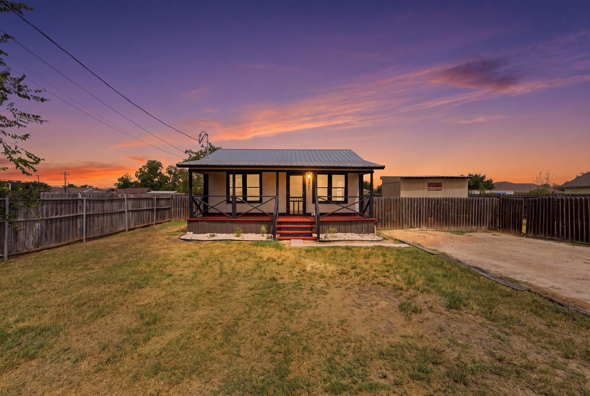 An inviting front porch welcomes you to this clas