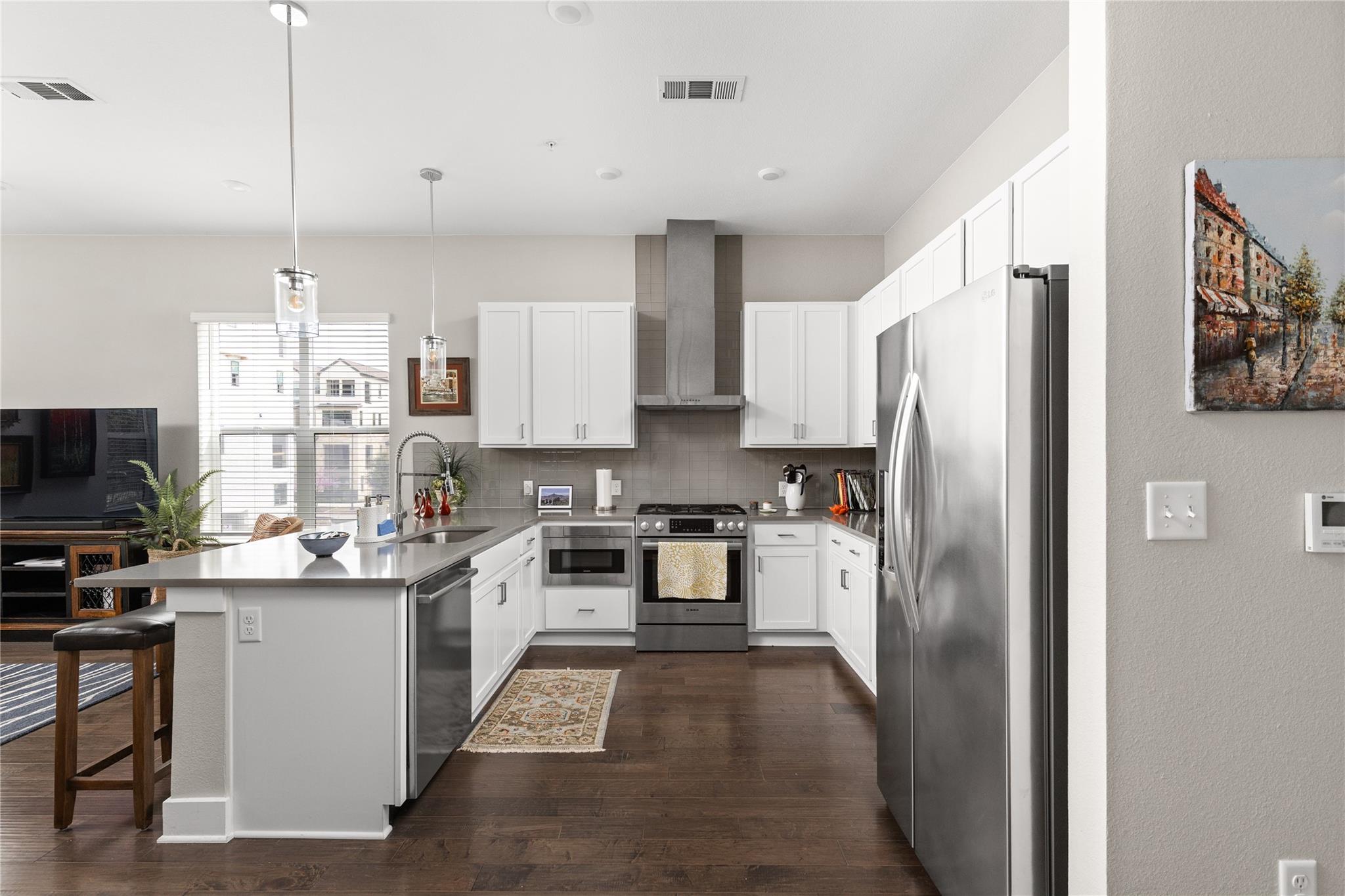 Rich hardwood floors anchor this modern culinary 