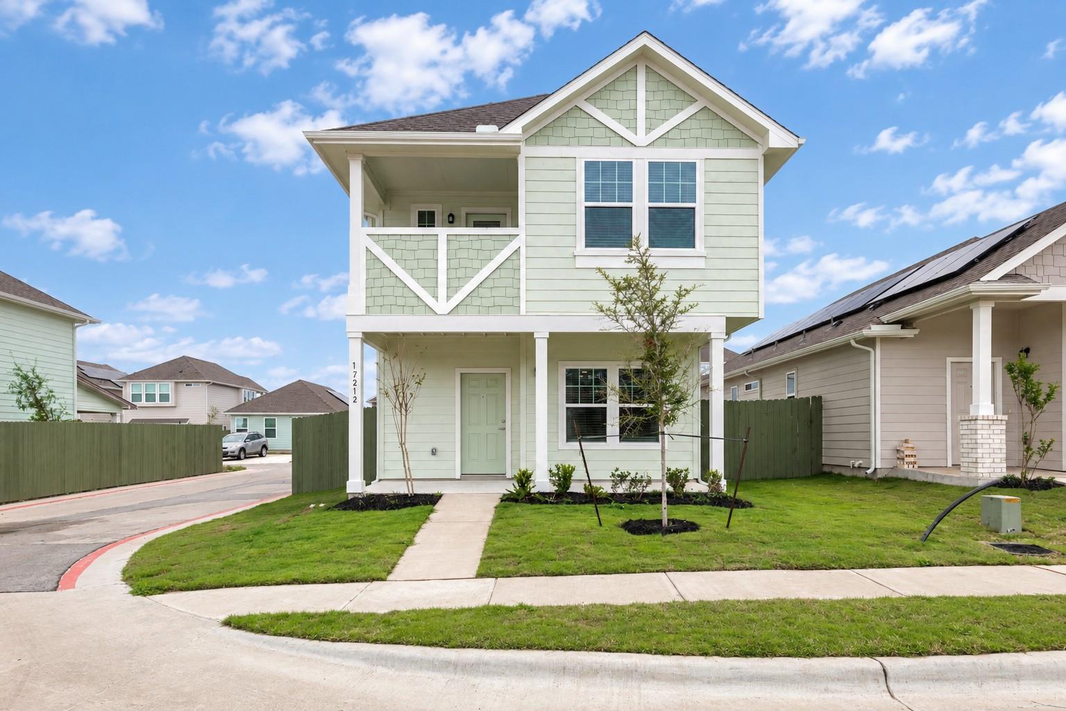 A classic two-story facade with neat siding and a