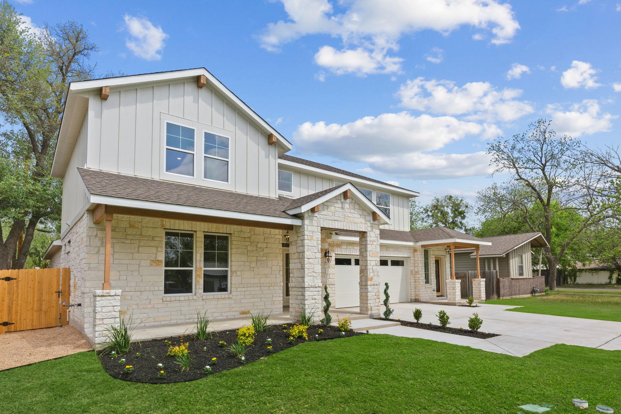 A striking modern farmhouse facade showcases a cl