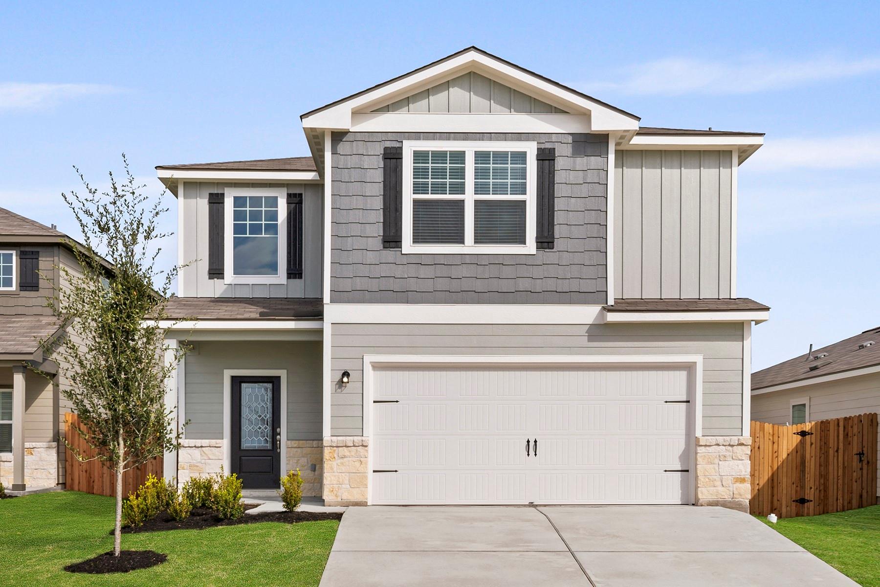 Two-story residence featuring a combination of ho