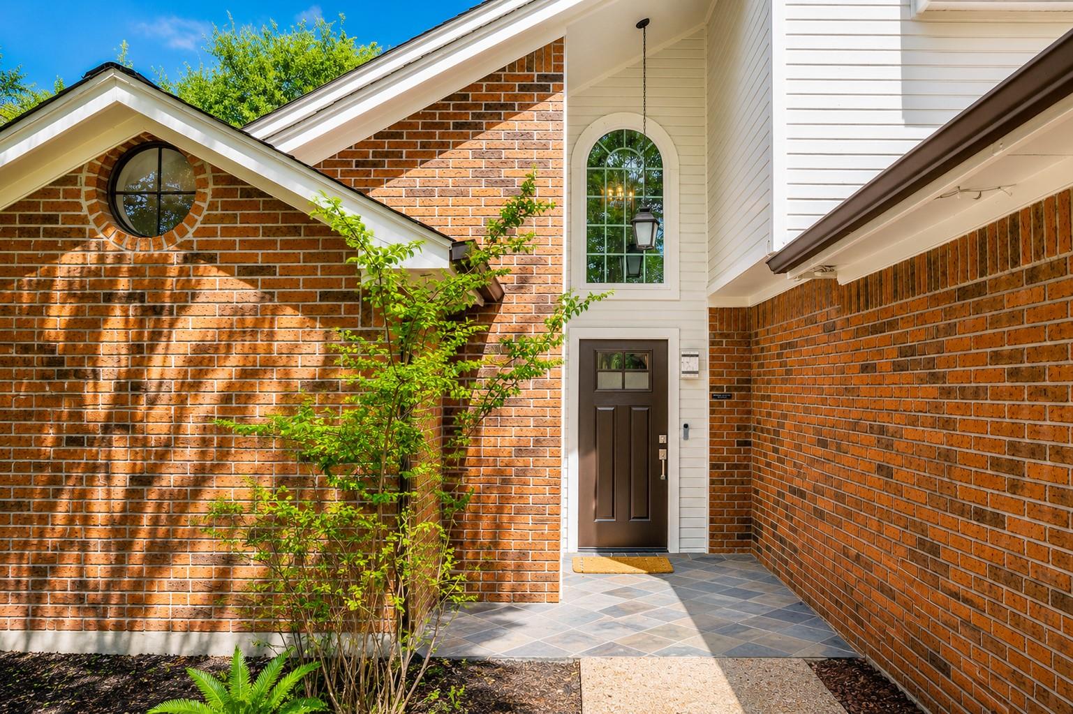 Rich brickwork and a soaring arched window frame 