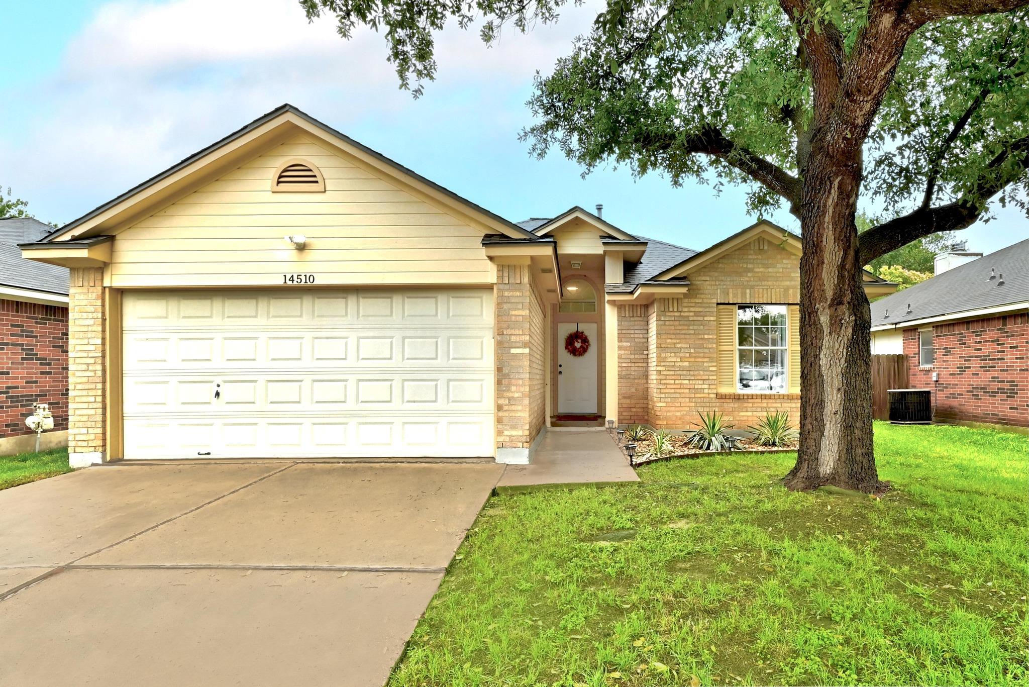 Brick and siding accents define the exterior of t