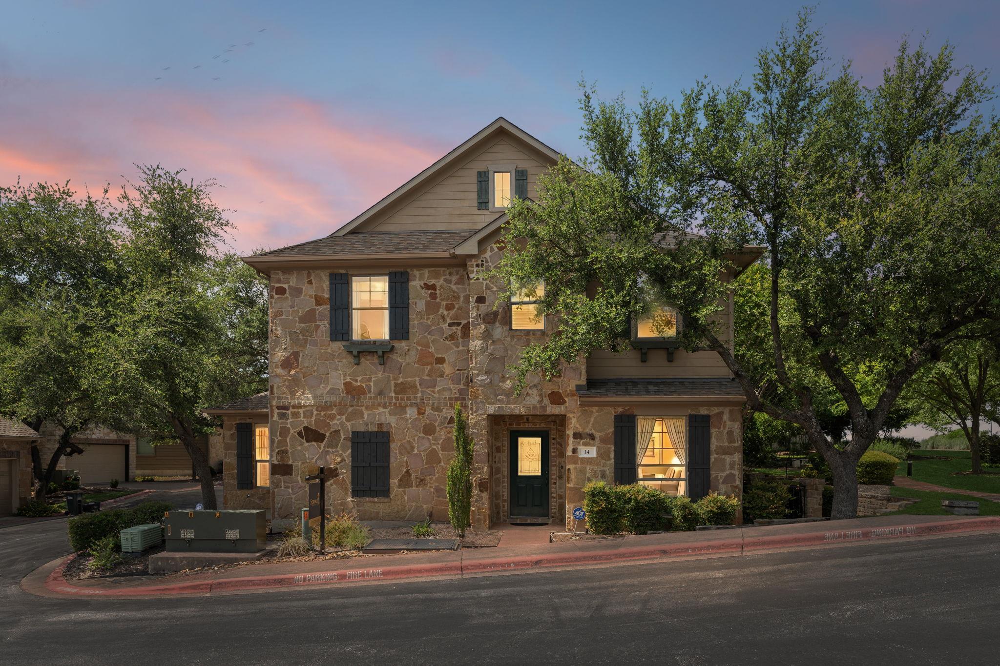 A striking stone facade with inviting windows glo
