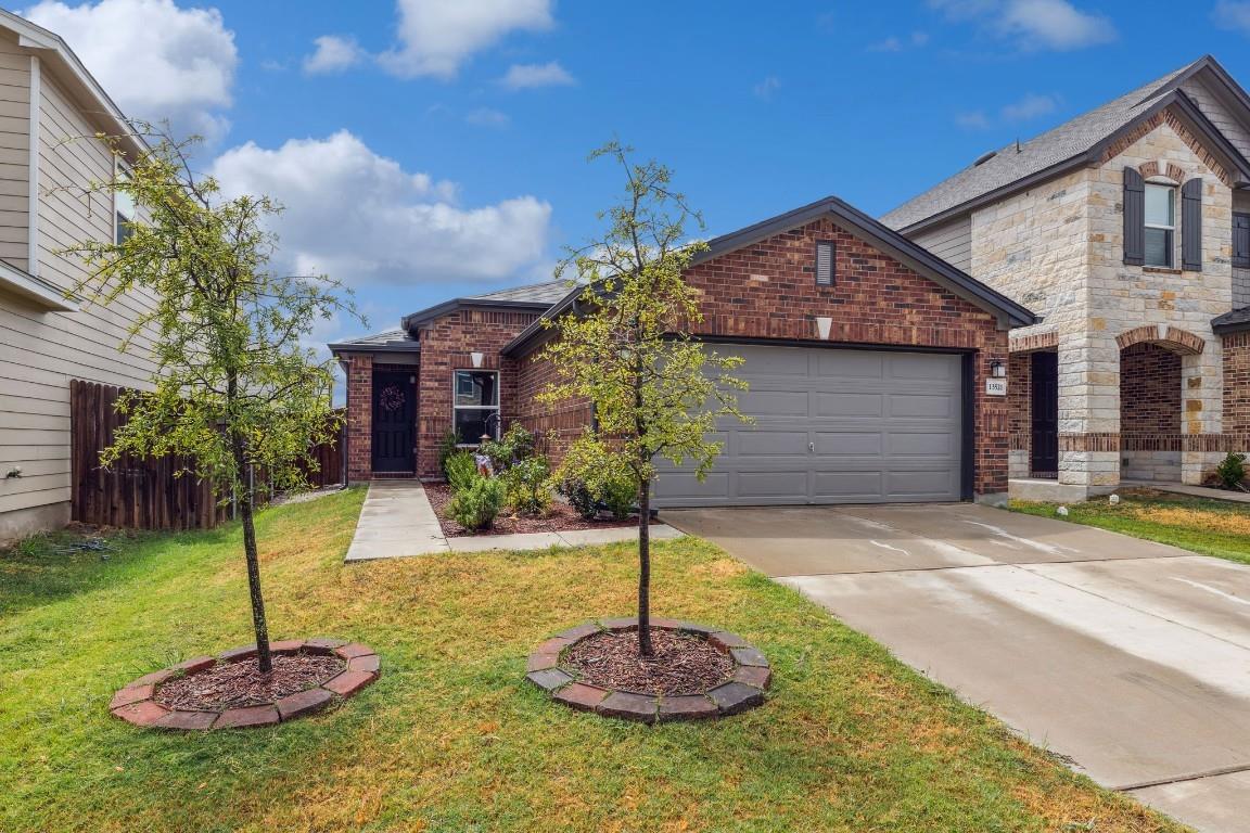 Classic brick exterior showcases an attached two-
