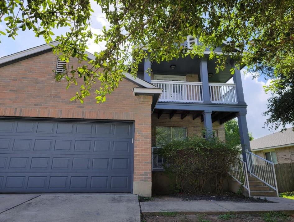 Classic brick and siding accents define this mult