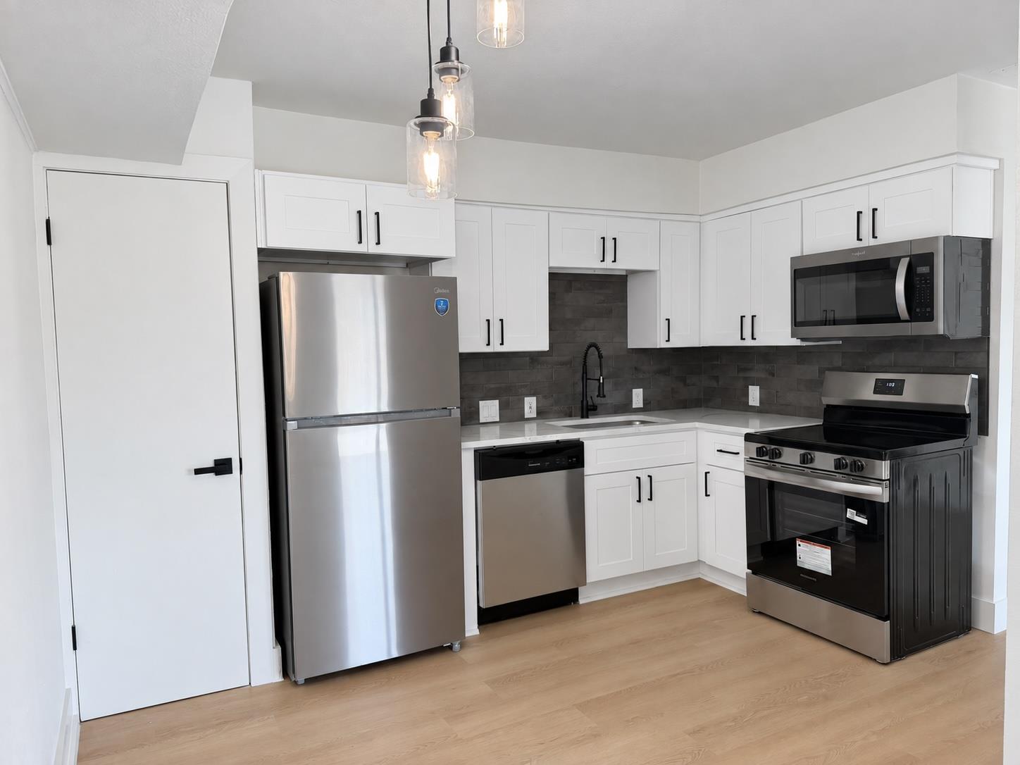 Crisp white cabinetry pairs with stainless steel 