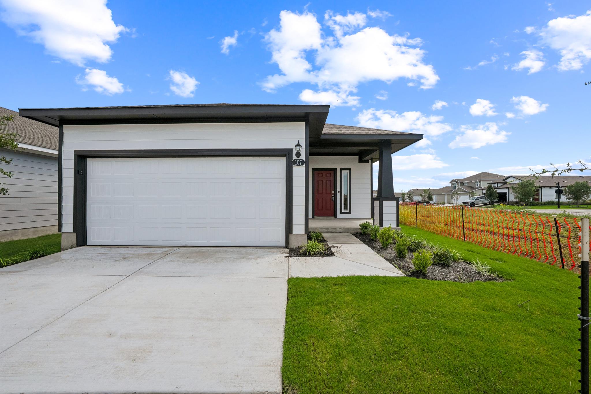 Clean lines and a spacious driveway define this m