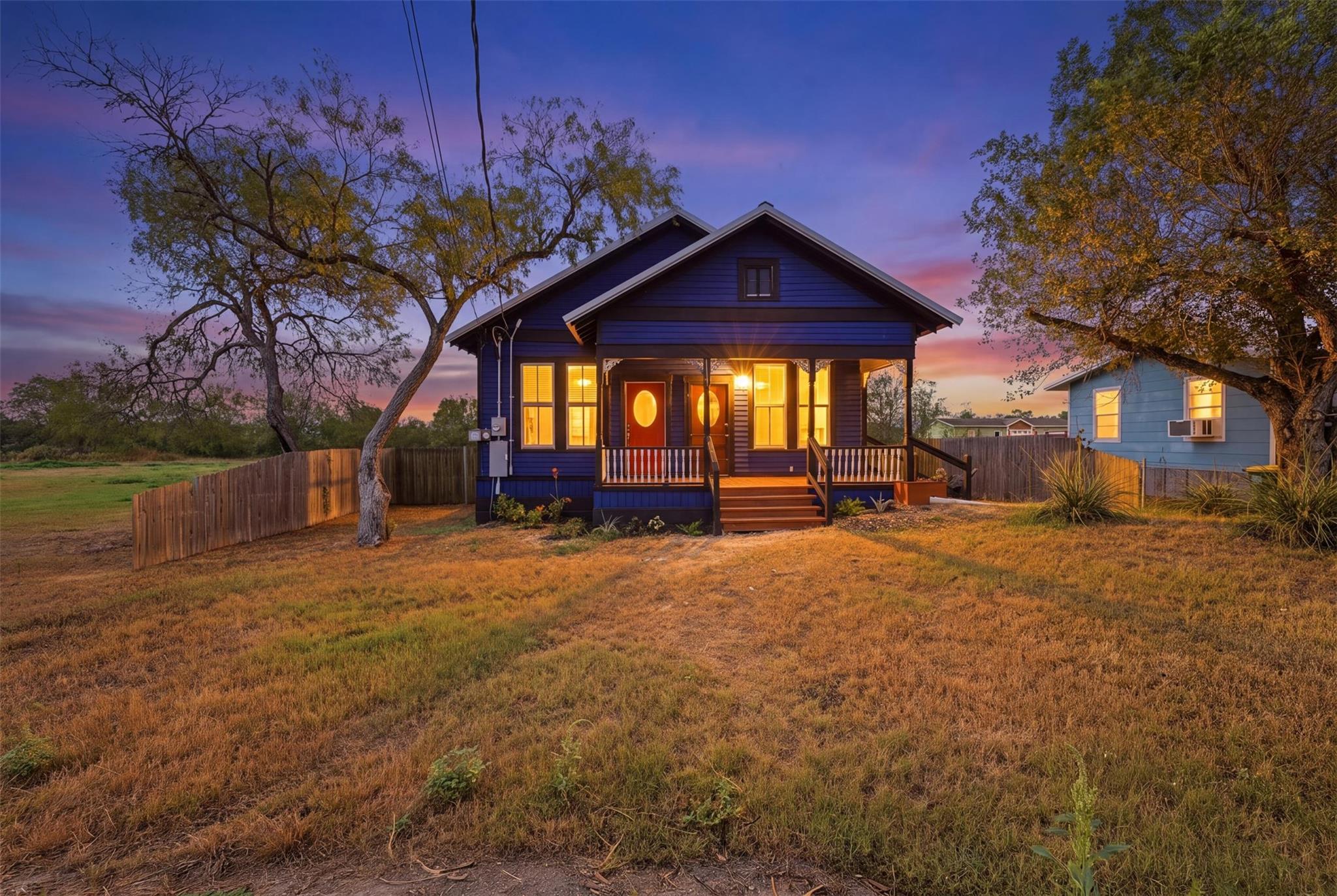 Charming wooden siding and an inviting front porc