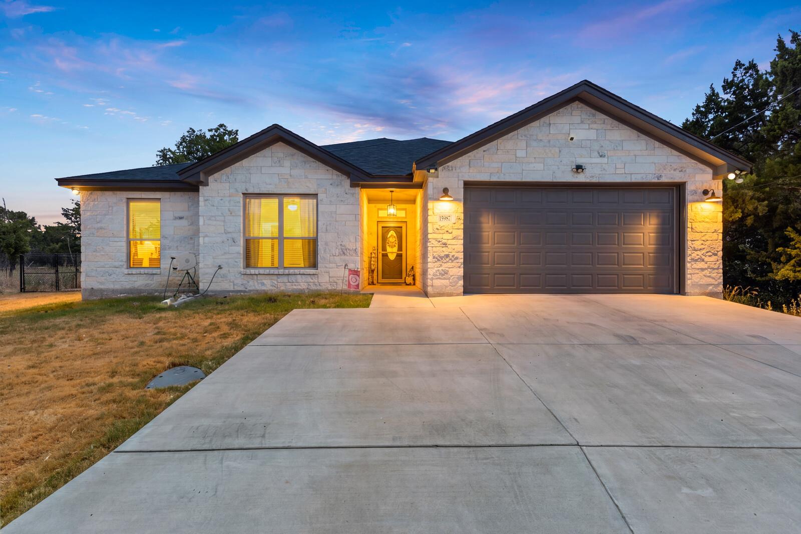 Textured light stone masonry defines this single-