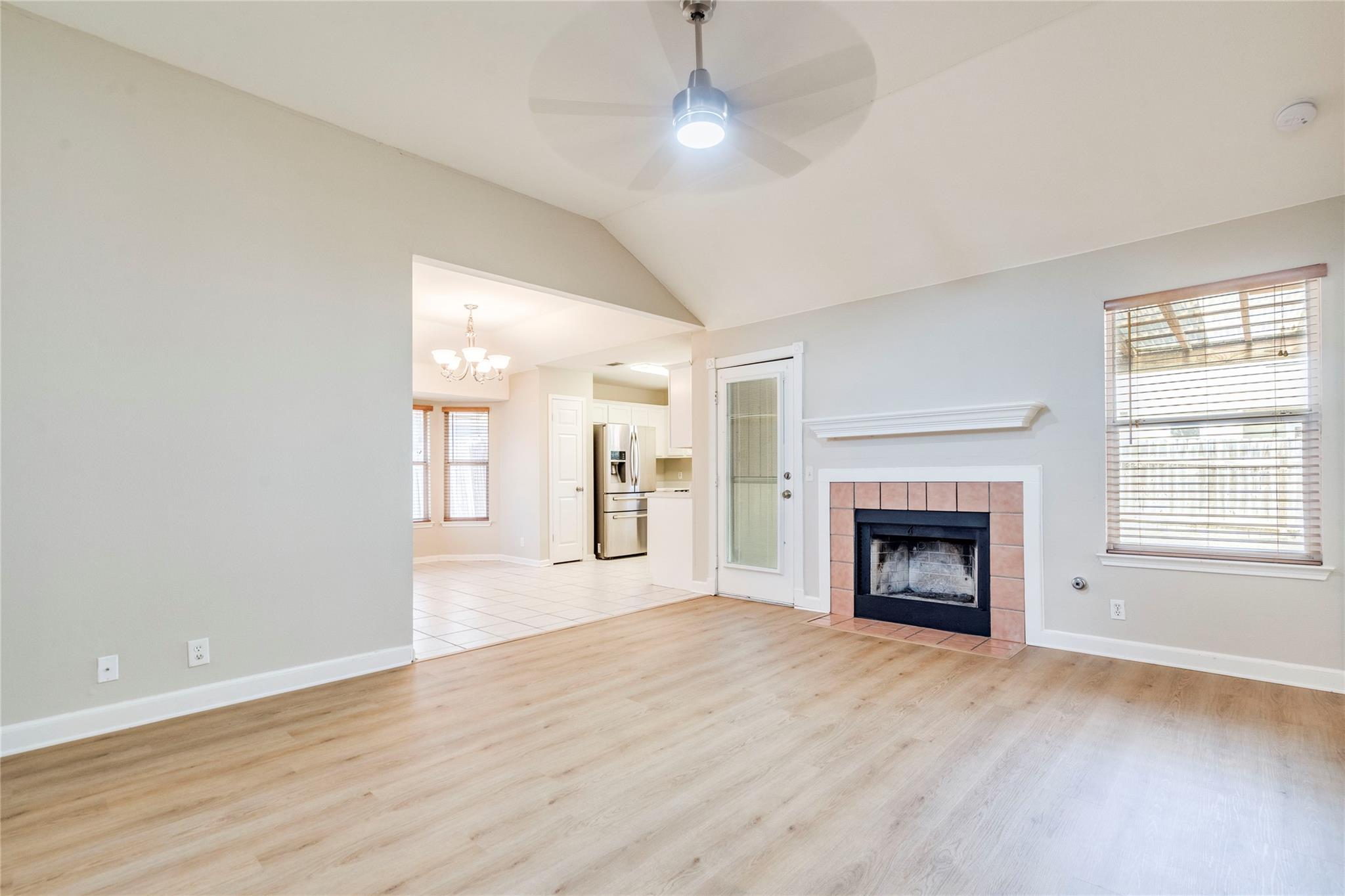 An inviting fireplace serves as the focal point o