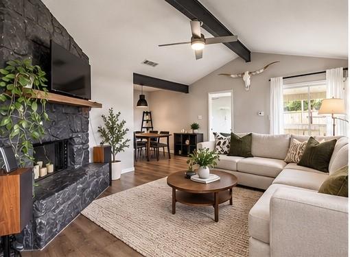 Vaulted ceilings with exposed beams arch over a h