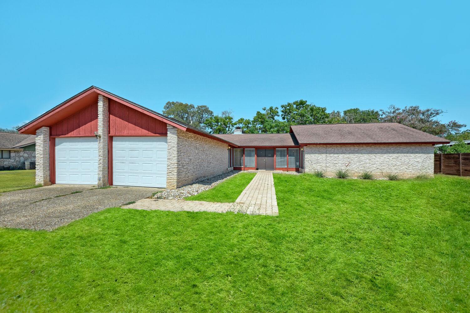 Mid-century architectural styling pairs a stone f