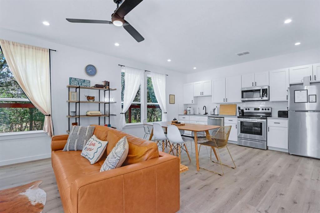 Gleaming wood flooring complements the airy open 