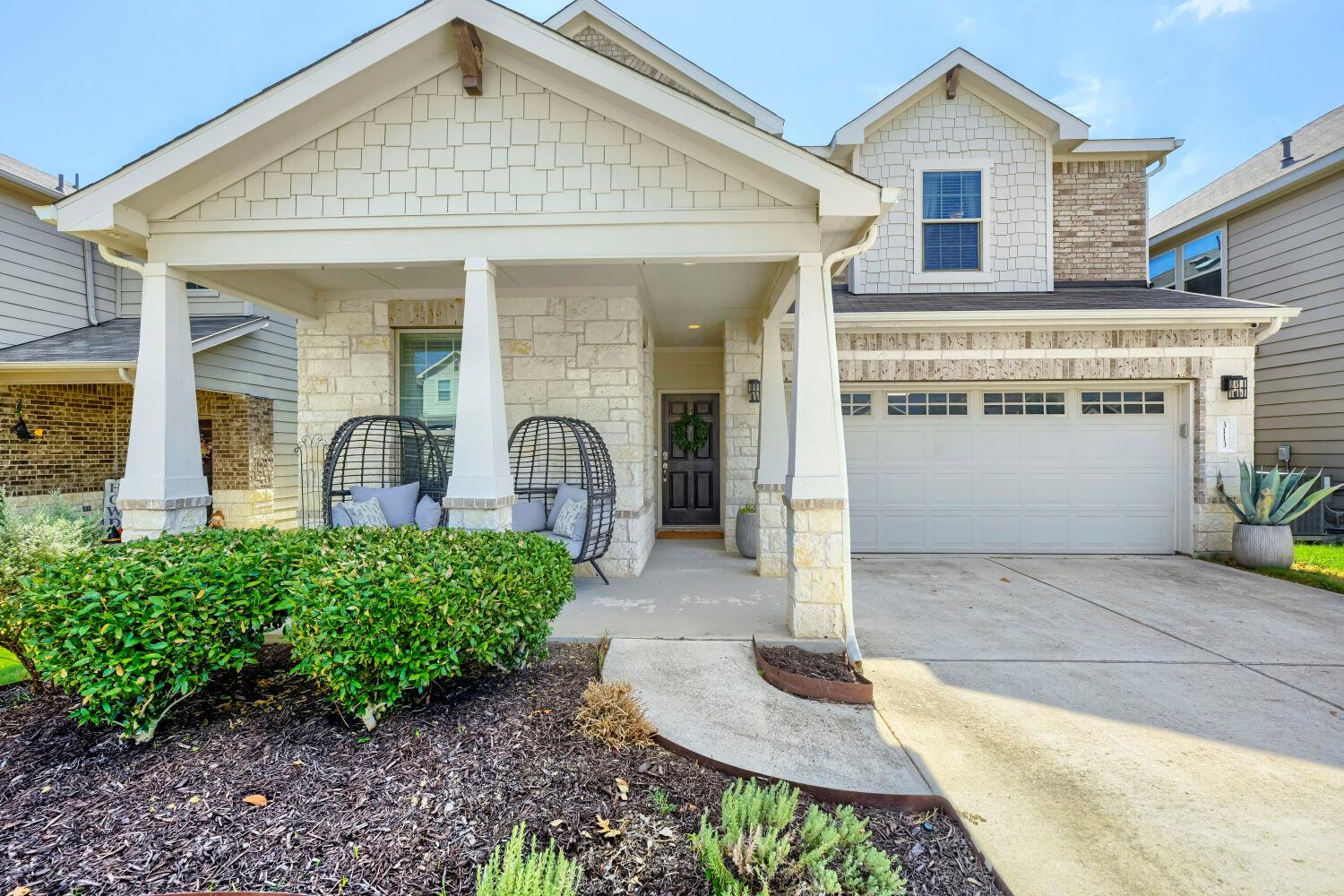 Craftsman architectural details and a welcoming f