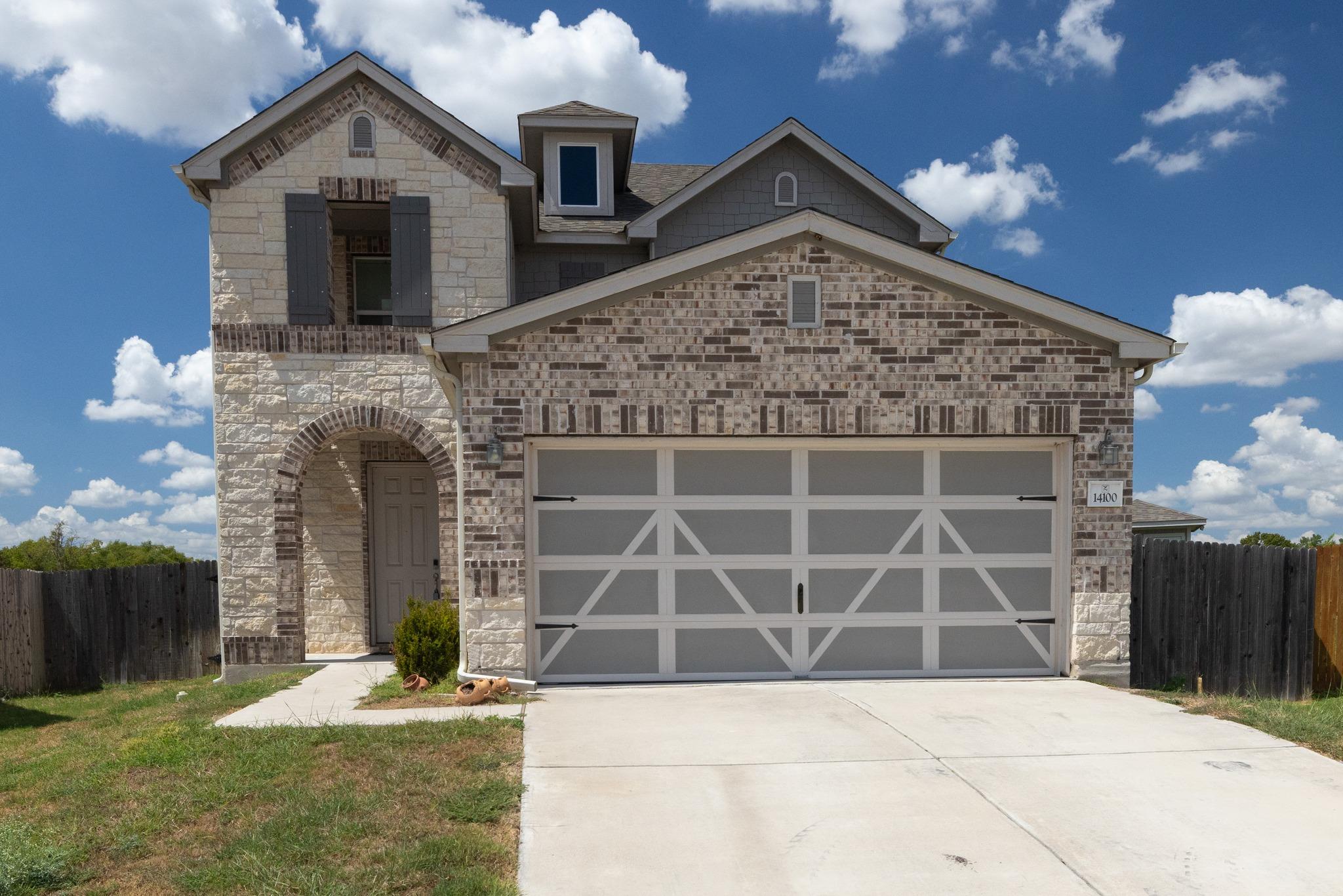 A spacious concrete driveway leads to the integra