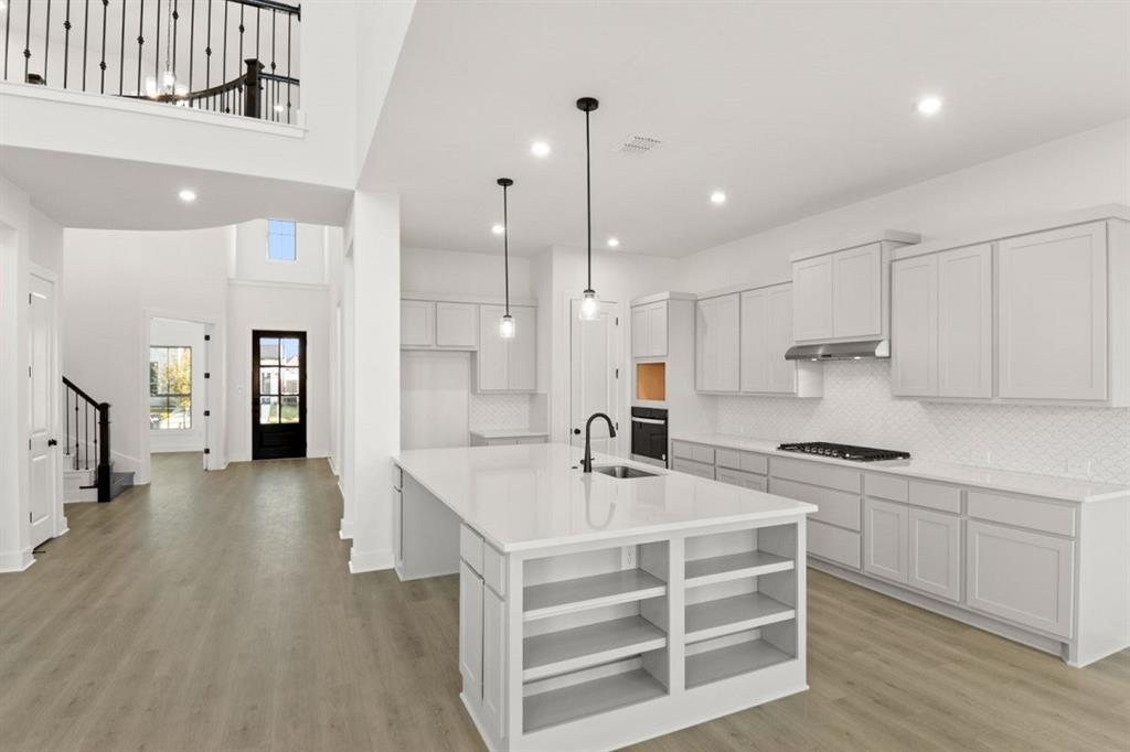 An open floor plan seamlessly connects the kitche