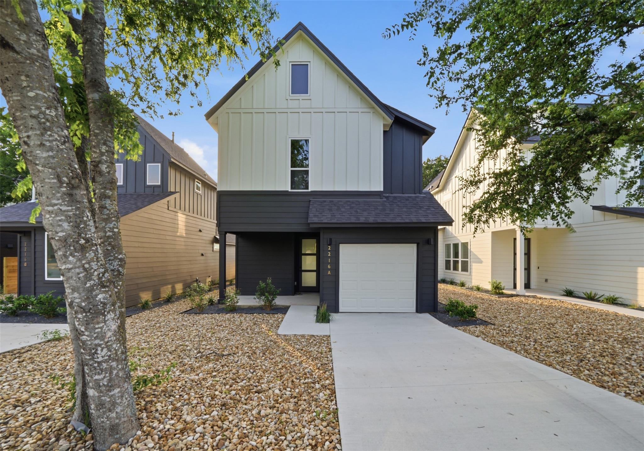 A striking modern farmhouse elevation showcases c
