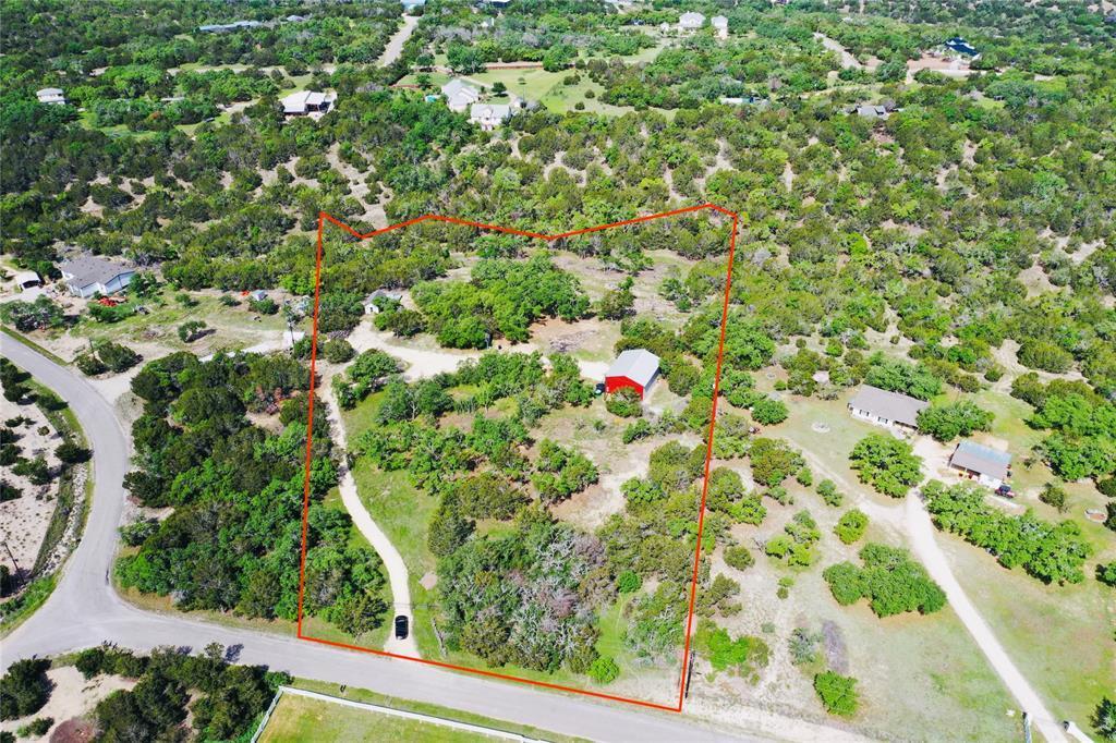 Mature trees blanket this sprawling acreage offer