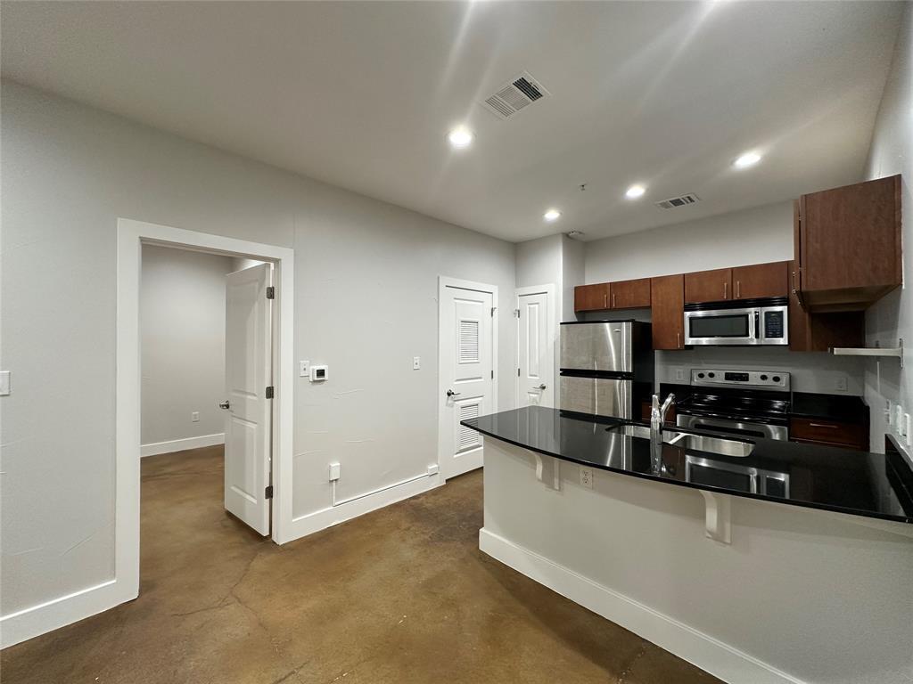 Polished concrete floors and sleek stone counters