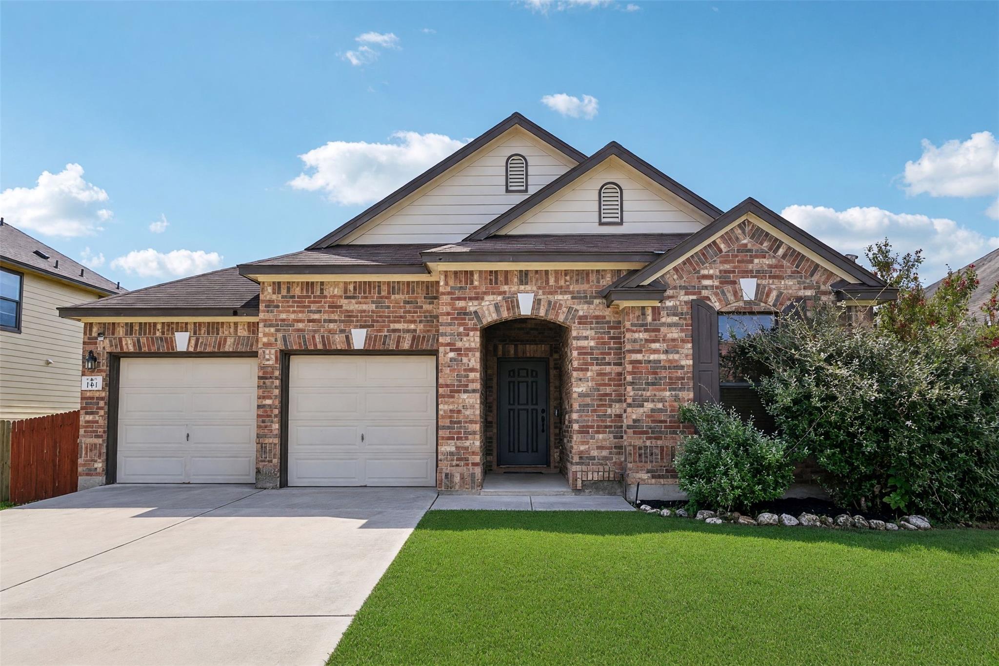 Multi-textured brick masonry creates an inviting 